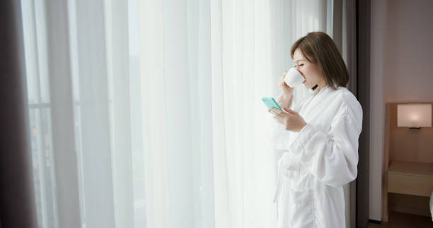 istock woman use smartphone in morning 1171929583