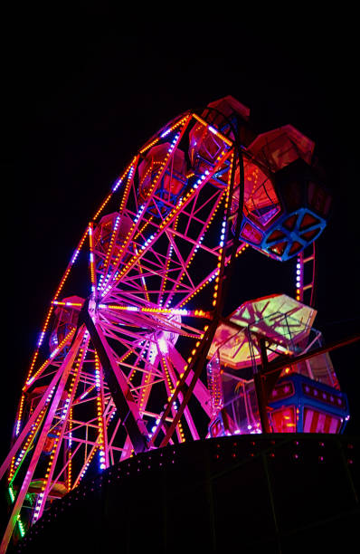 istock Ferris wheel at night with red light. 1171933567