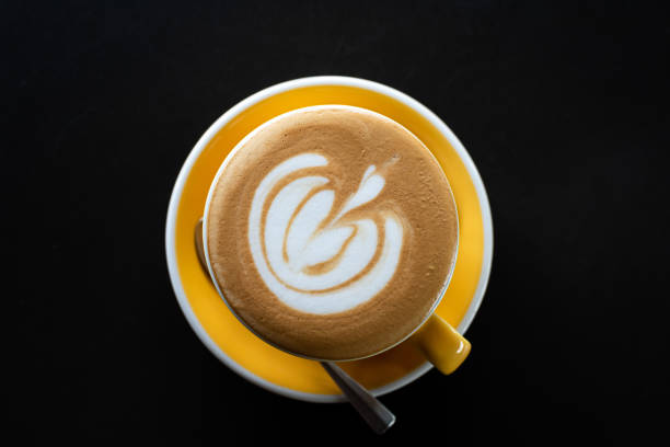 istock A cup of coffee with beautiful latte art on black table background. 1171936323