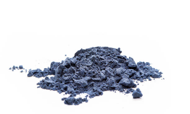 Blue matcha tea powder close-up Blue matcha tea powder close-up on a white background, front view. indigo dye stock pictures, royalty-free photos & images