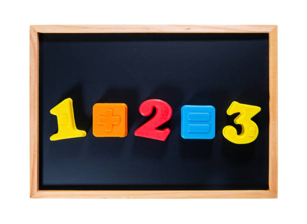 Boy spelling out the word school. Magnet letters on black board in preschool or kindergarten classroom. Kids learn the alphabet. Children read and write. Student having fun. Back to school poster.