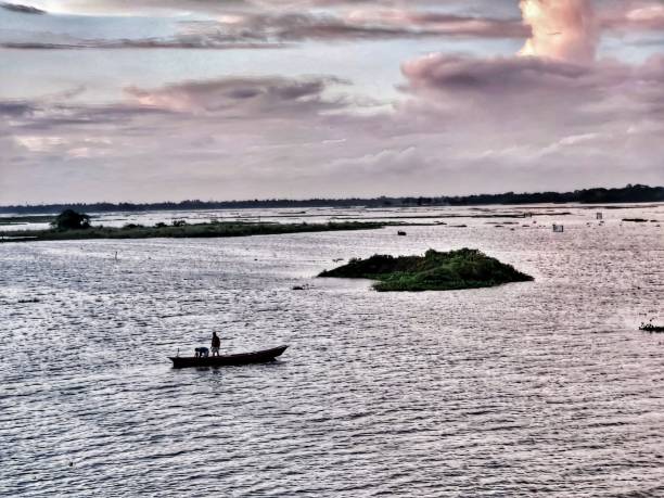 istock fisherman fishing in lake 1171939376