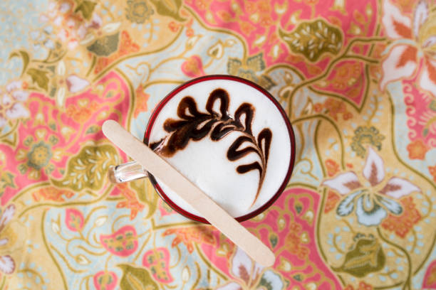 Gingerbread man bathing in cup of hot chocolate