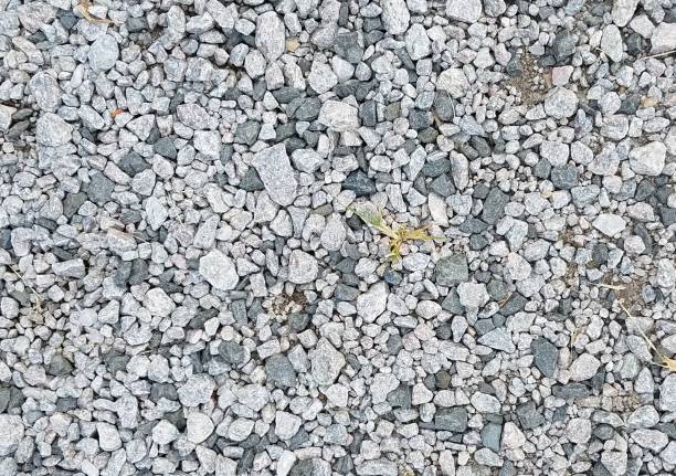 istock grey rocks or pebbles with weeds 1171939780