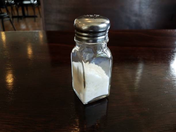 istock glass salt shaker with rice on wood table 1171939863