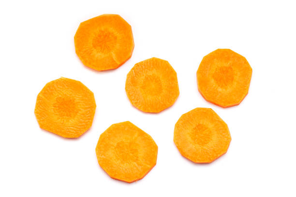 istock Some Carrot Slices, Carrot cut Pieces isolated on white Background 1171942300