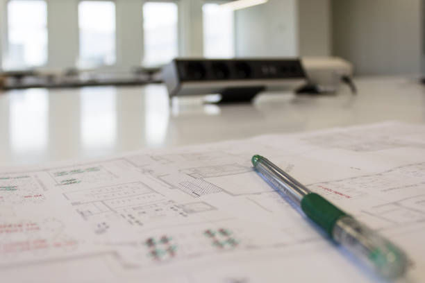 istock Ballpoint pen on an building plan in office 1171946097