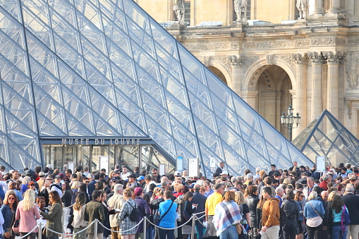 Paris France - May 22, 2019: People queue at Louvre museum Paris France.