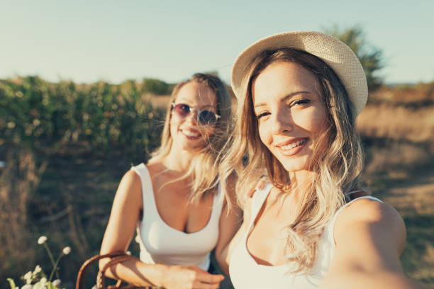 istock Two young adult taking a selfie in nature 1171948642