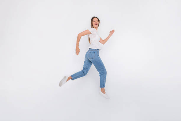 istock Photo of charming cute glad positive girlfriend going towards her goal ahead forward while isolated with white background 1171948705