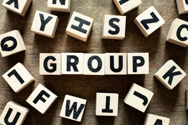 istock Letter block in word group with another block on wood background 1171950608