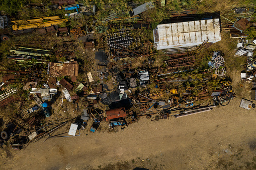 Abandoned place for metal waste, directly above view, on sunny day