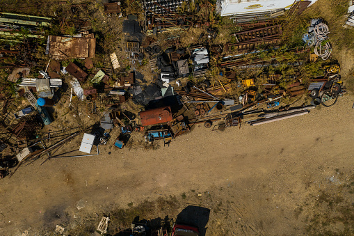 Abandoned place for metal waste, directly above view, on sunny day