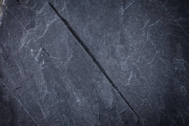 istock Dark grey and black slate background or texture 1171954671