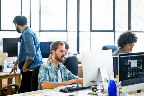 istock Business team working at desk in office 1171957734