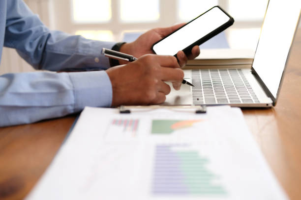 istock businessman using smart phone. startup man working at workplace 1171961167