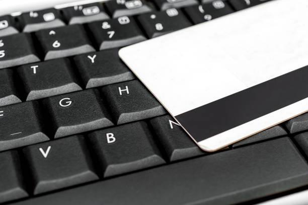 istock Credit card on laptop keyboard. Close up. 1171964094