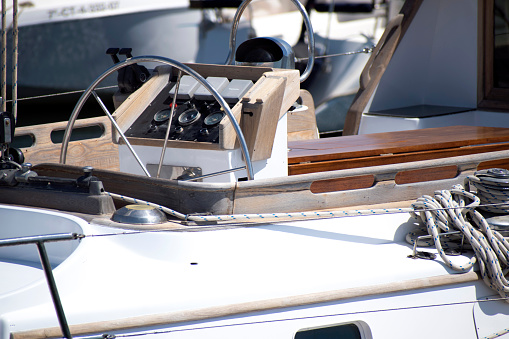 White brand new dashboard and steering wheel of a modern yacht