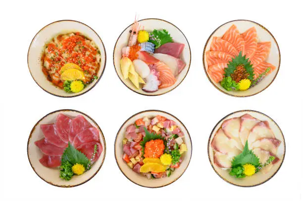 Variety of Donburi set with Seafood, Salmon, Maguro, Hamachi and japanese rice in bowl on the table