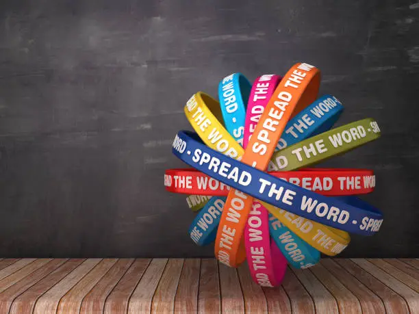 Photo of Circular Ribbons with SPREAD THE WORD Phrase on Chalkboard Background - 3D Rendering