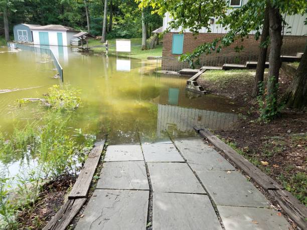 istock grey stone tiles leading down to water flooded area 1171976713