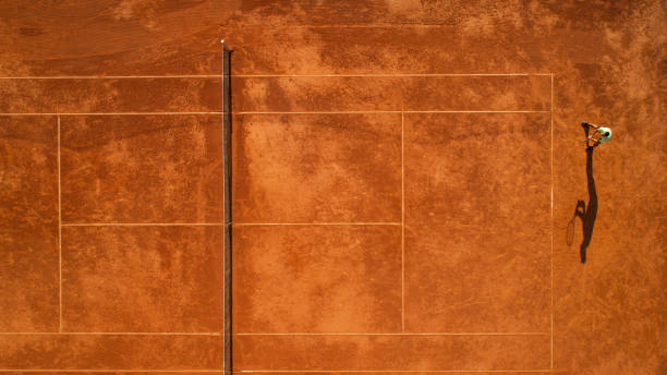 istock One tennis player on clay court 1171977201