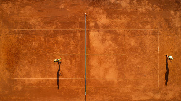 istock Two tennis players on court 1171977337