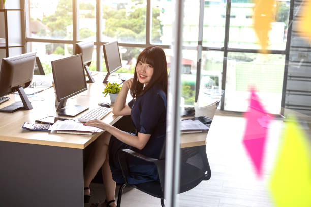 istock Beautiful young staff sitting at the office desk 1171978941