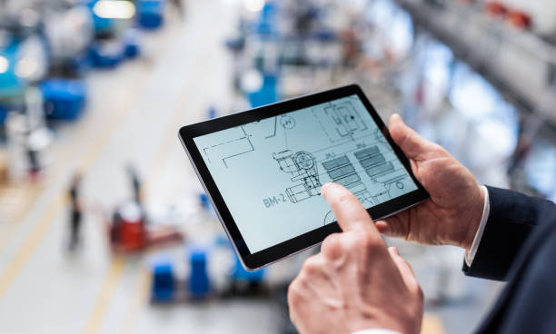 istock Businessman Using Digital Tablet In A Factory 1171979872