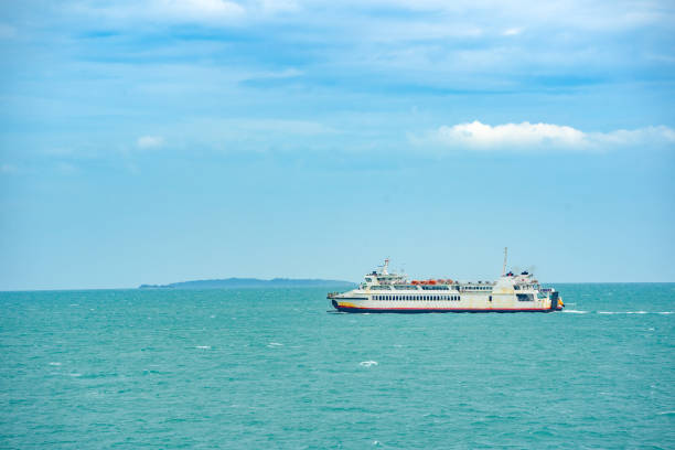 istock Boat ship on green sea and blue sky and cloud background 1171980623