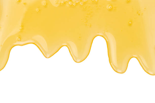 istock Texture of honey drips patterns isolated on white background 1171982529