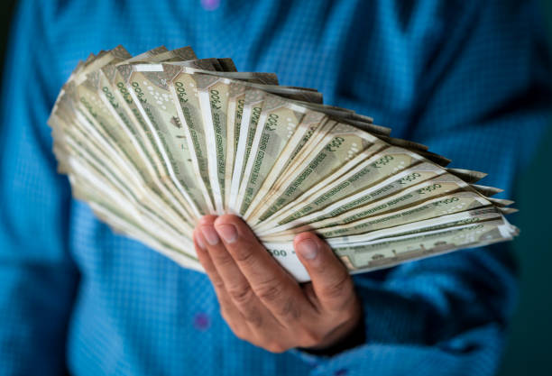 istock Indian Businessman Holding Indian Currency 1171982805