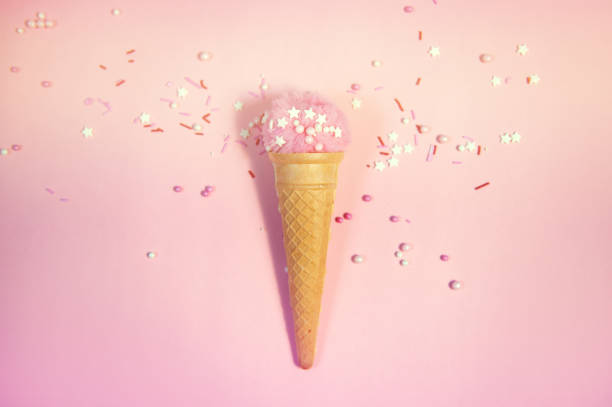 istock Colorful sprinkles on a pink background, top view with copy space 1171983317