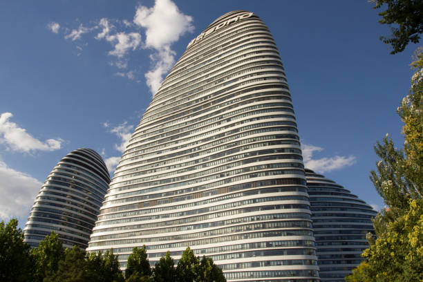 Beijing, China - June 29, 2019: Architectural details of Wangjing SOHO, a complex of three curvilinear asymmetric skyscrapers in Wangjing, a suburb of Beijing. It was designed by architect Zaha Hadid.