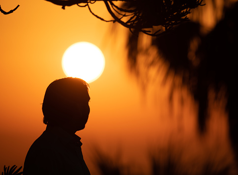 Man enjoying colorful sunset