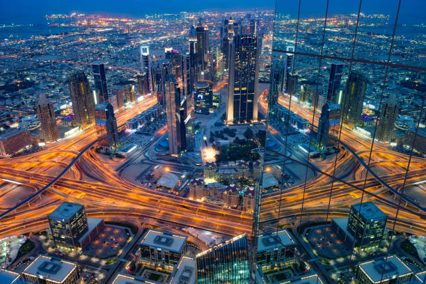 New Dubai by night reflected in glass facade