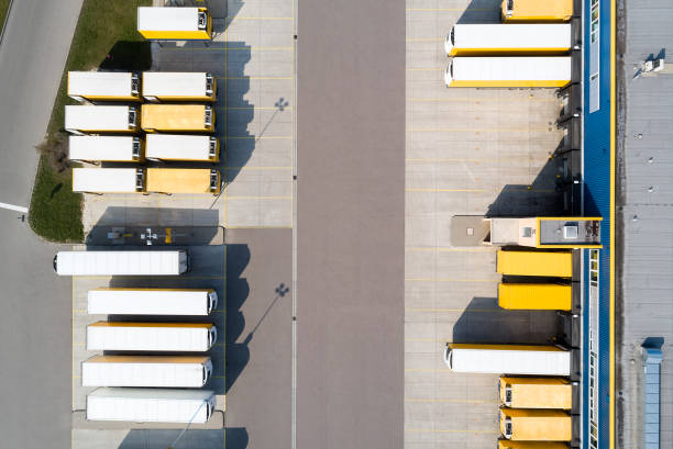 istock Aerial view of Semi-Trucks Loading at Logistic Center, Distribution Warehouse 1171988573
