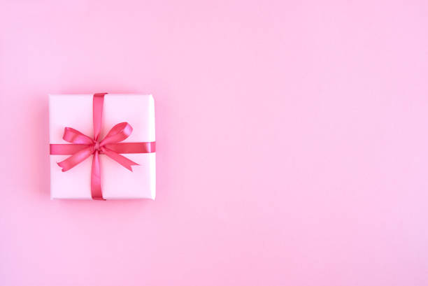 istock Gift box with ribbon and bow on color background and space for text. Top view 1171989865