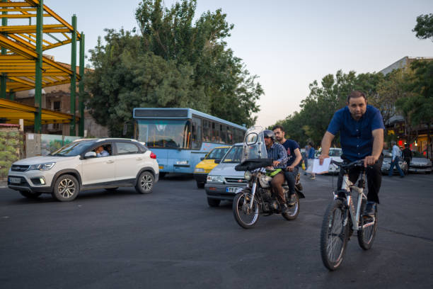 Tabriz, Iran - 11 August 2019: cycling in traffic