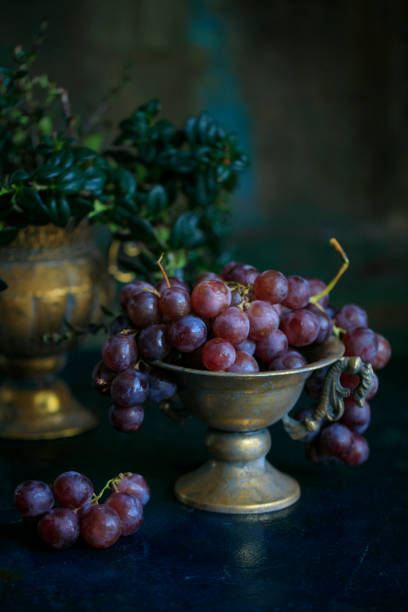 istock bunch of ripe grapes in a bronze bowl 1171995711