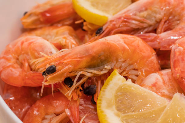 istock delicious boiled tiger shrimps with lemon slices 1171996437