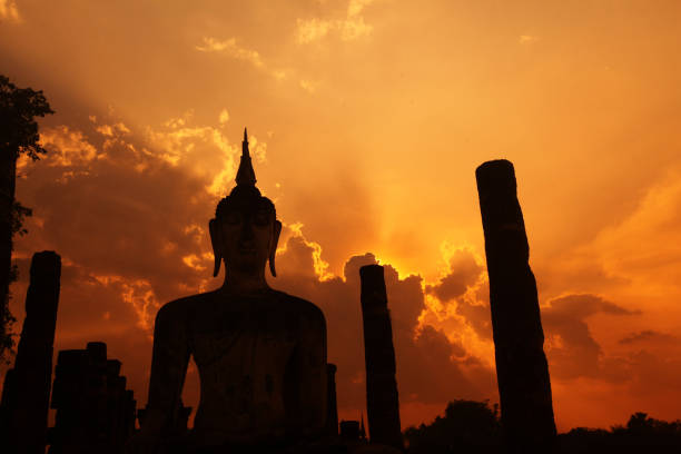a Buddha at the Wat Mahathat Temple at the Historical Park in Sukhothai in the Provinz Sukhothai in Thailand.   Thailand, Sukhothai, October, 2012
