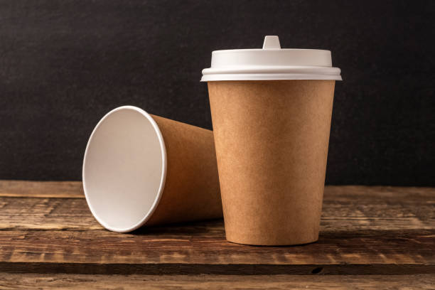 istock Disposable cup from Kraft on a wooden table with copy space 1171999460