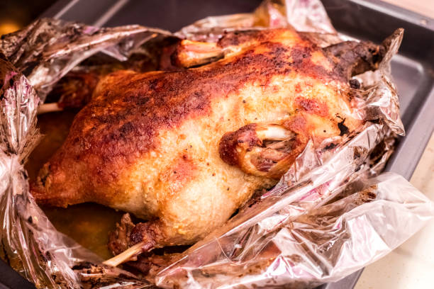istock Whole roasted duck on a sheet of oven 1171999718