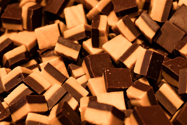 istock candies of white and dark chocolate, close up 1172006270