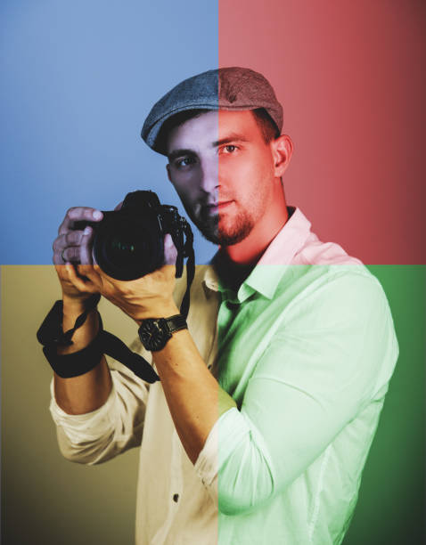 Young man using a professional camera stock photo