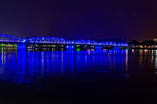 istock Night scene of a bridge in blue lights 1172007108