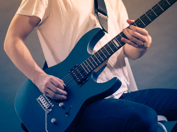 istock Male hands playing electric guitar 1172011262