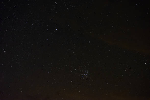 istock Stars in the night sky through the clouds 1172011367