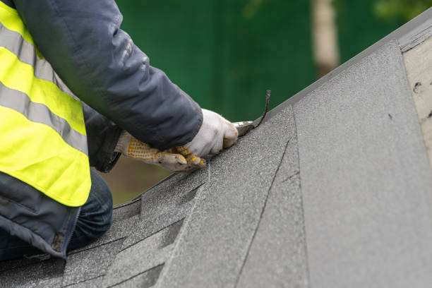 istock Workman install tile on roof of new house under construction 1172013075